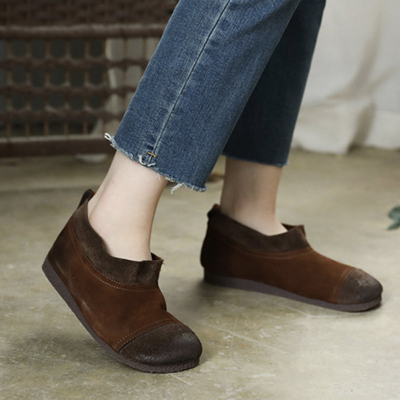 Cozy leather round-toe flats worn on feet