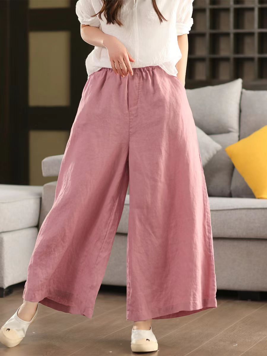 Model wearing relaxed wide-leg pink pants for a summer look