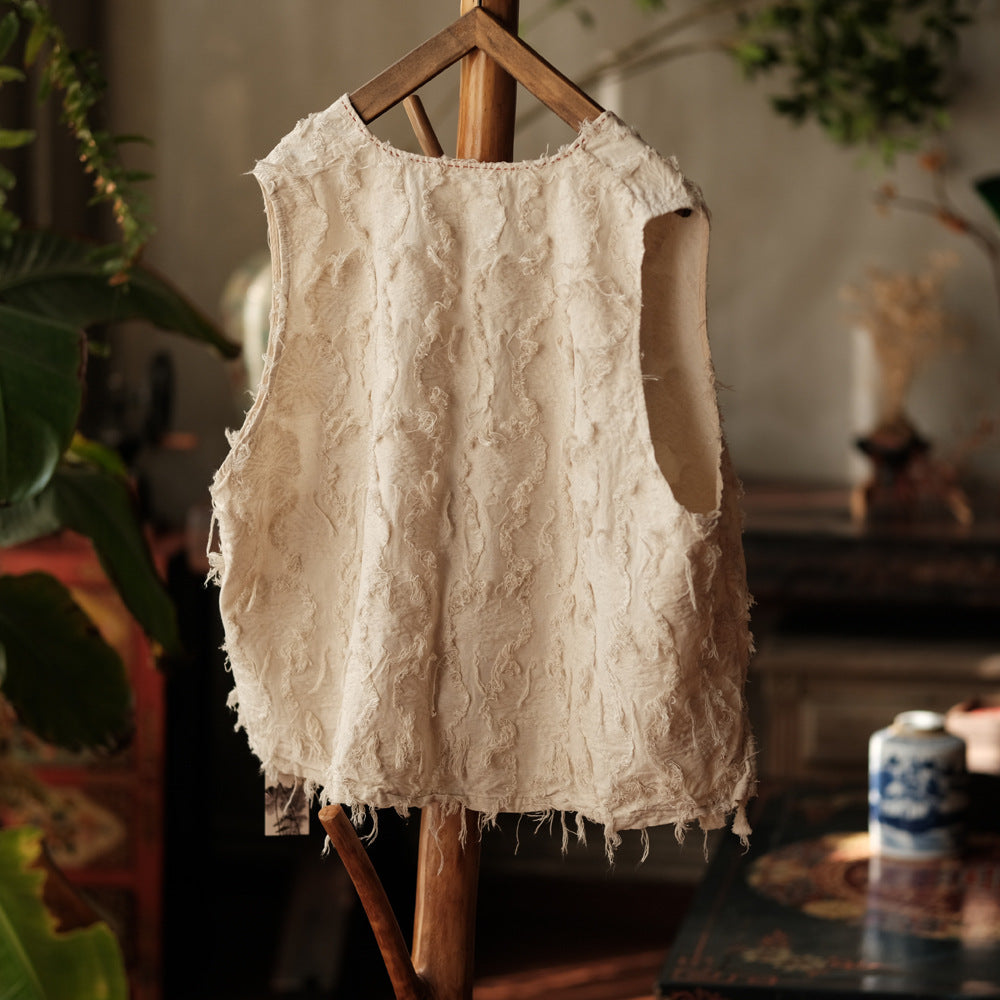 Close-up detail of fringe hem on vintage cotton-linen vest