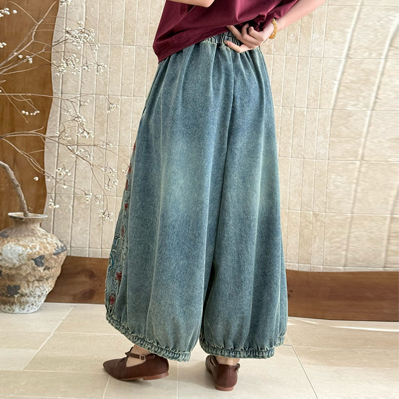 Back view of relaxed vintage embroidered denim pants