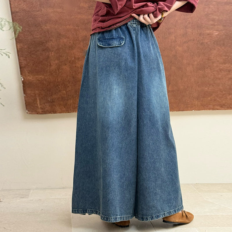 Back view of vintage embroidered denim pants with an easy silhouette