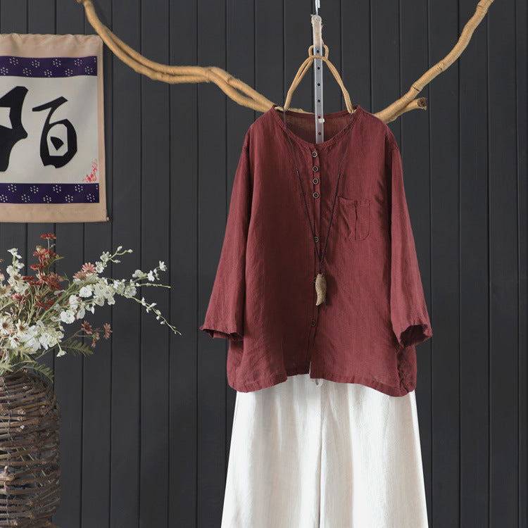 red linen shirt paired with casual bottoms