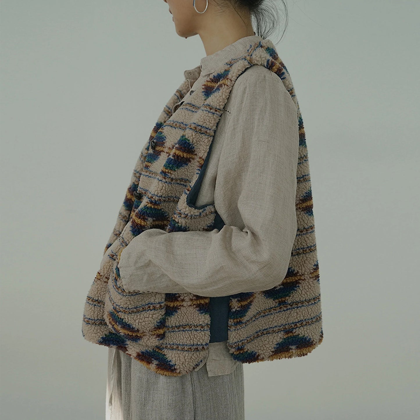 Vintage Cozy Faux Shearling Vest styled with sweater and jeans