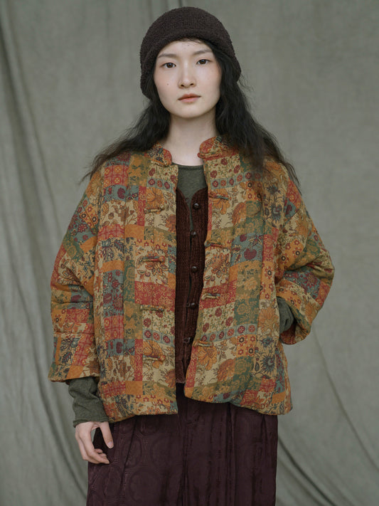 Amber Bloom patchwork down coat in warm orange floral tones front view