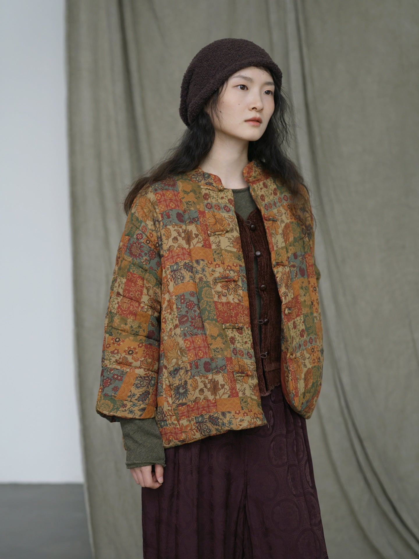 Vintage floral patchwork down coat back view in amber color palette