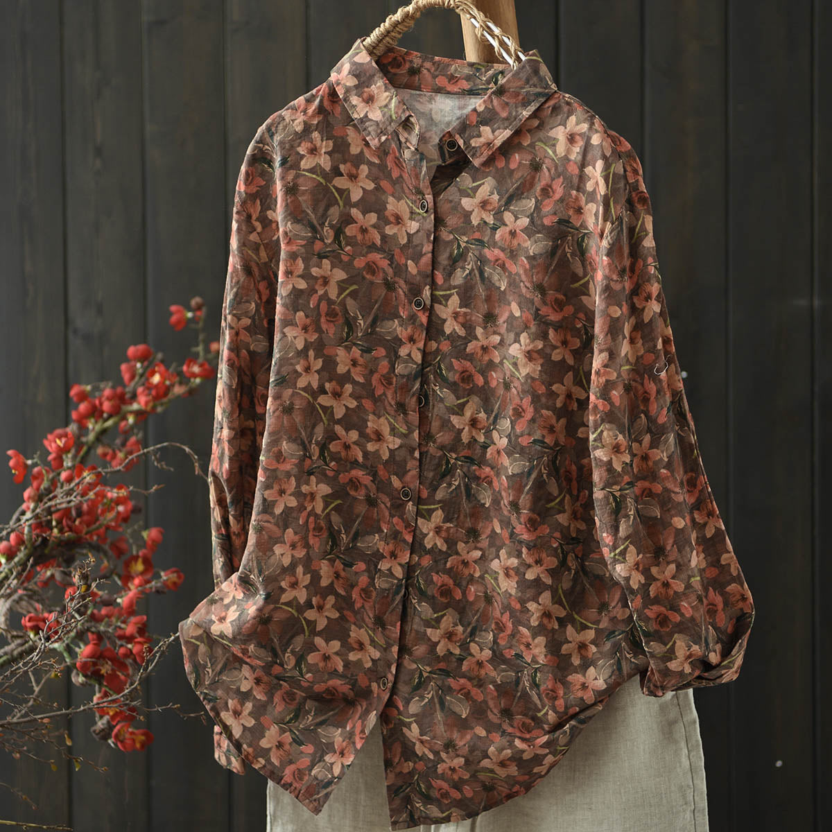 bohemian floral details on the vintage distressed blouse, highlighting its lightweight unlined design.
