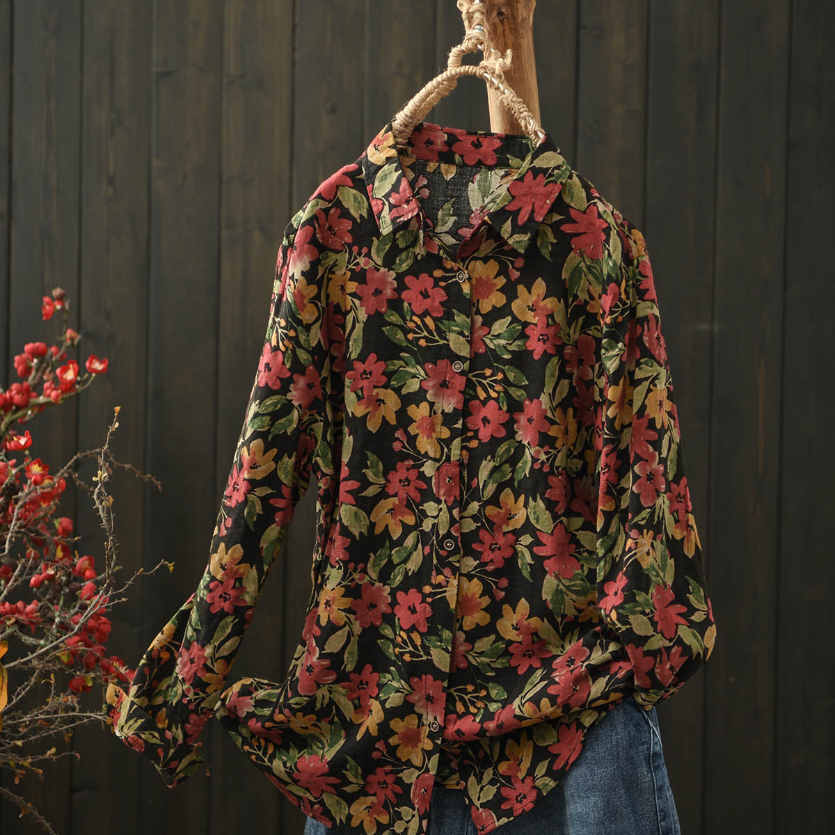 Close-up of the distressed floral pattern and soft fabric texture on this bohemian vintage-inspired shirt