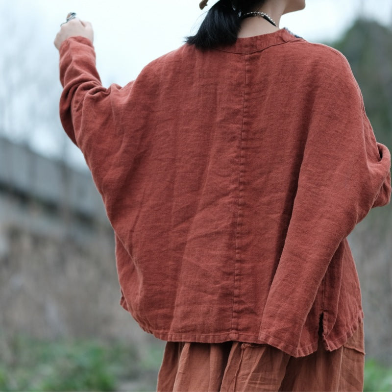 Back view showing relaxed fit of embroidered linen blouse