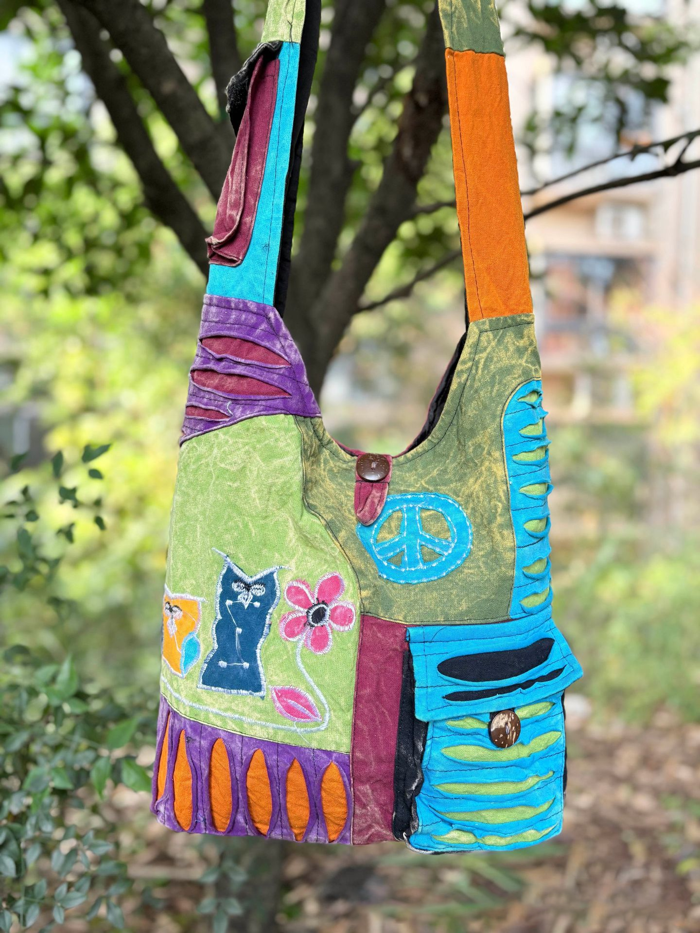 Woman wearing Nepal handmade boho shoulder bag