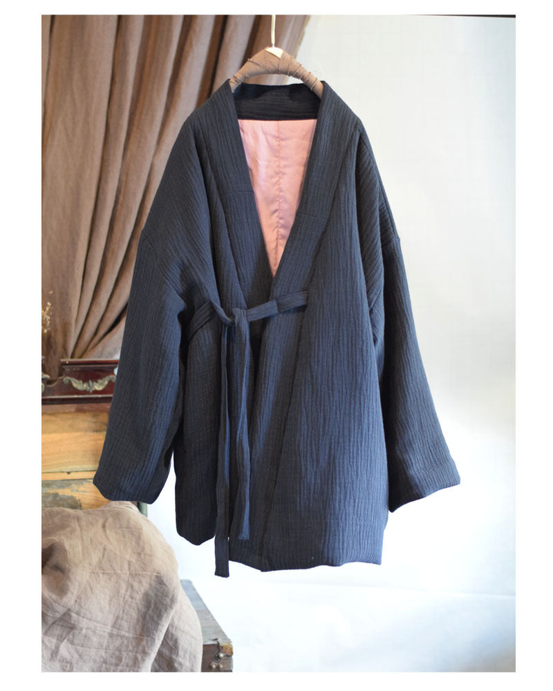 Close-up of tie-front closure on quilted kimono jacket