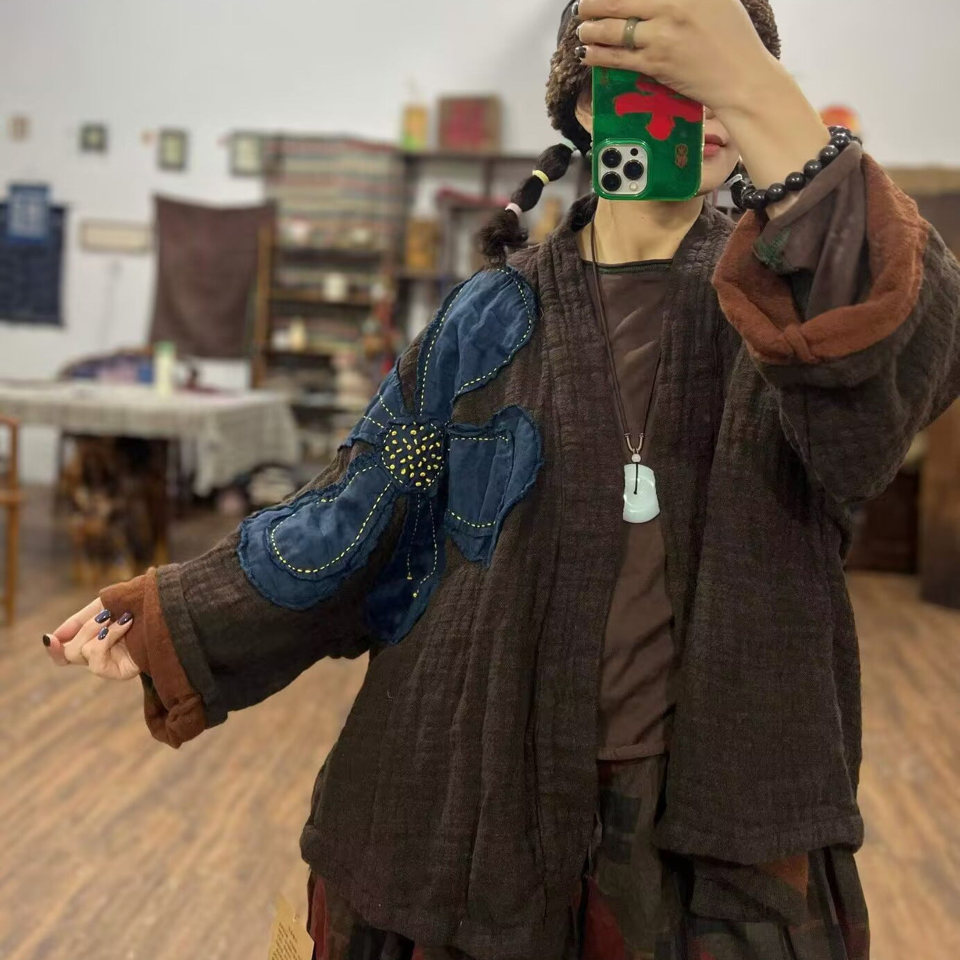 Close-up of appliqué detail on linen cardigan