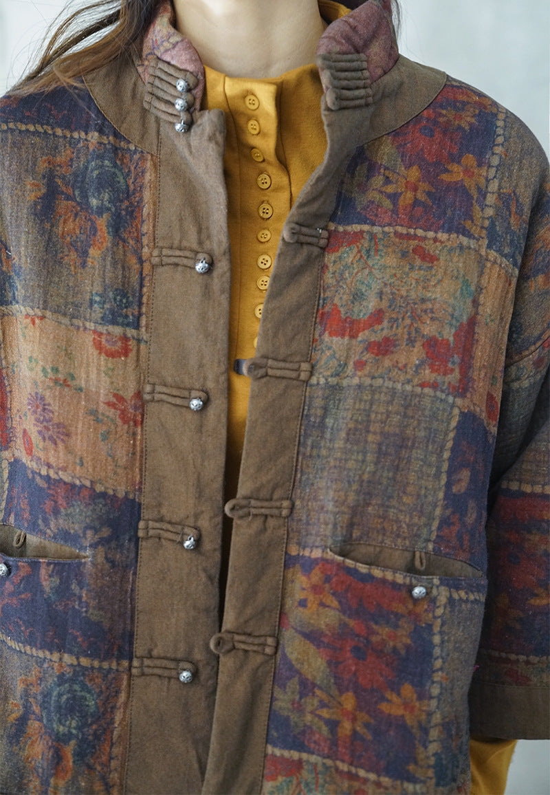 Close-up of distressed vintage print on quilted jacket