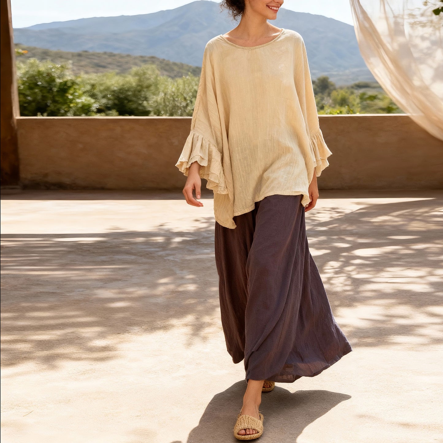 Lifestyle shot of an elegant cotton linen top styled for summer.