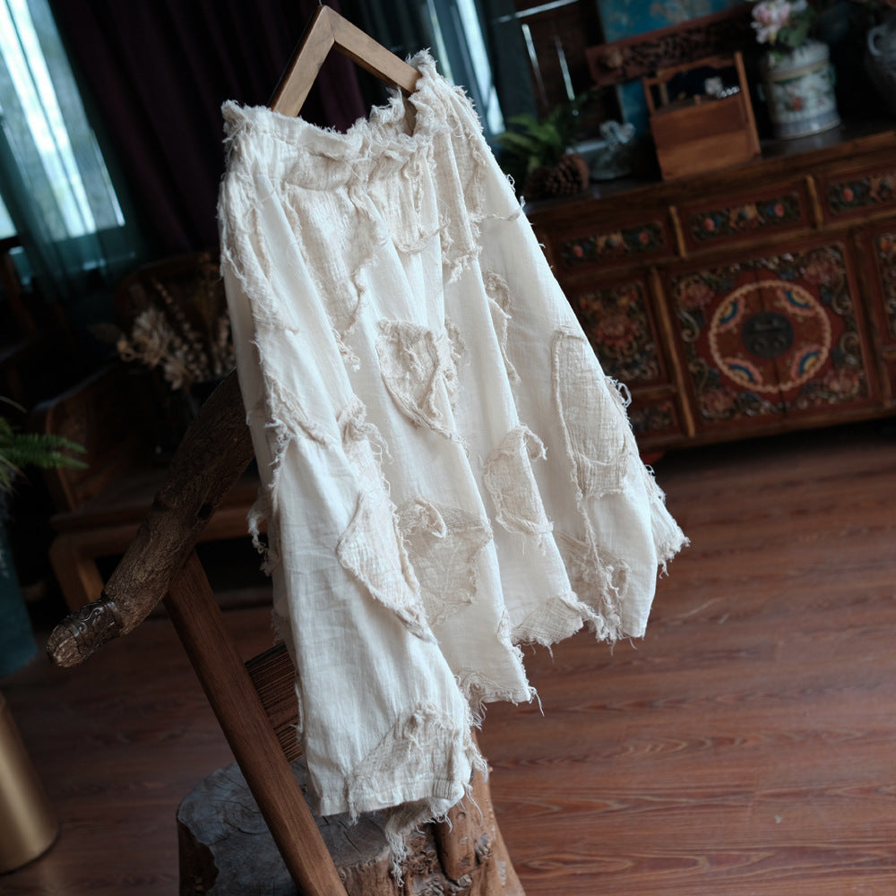 Close-up of ruffle collar on lightweight cotton top