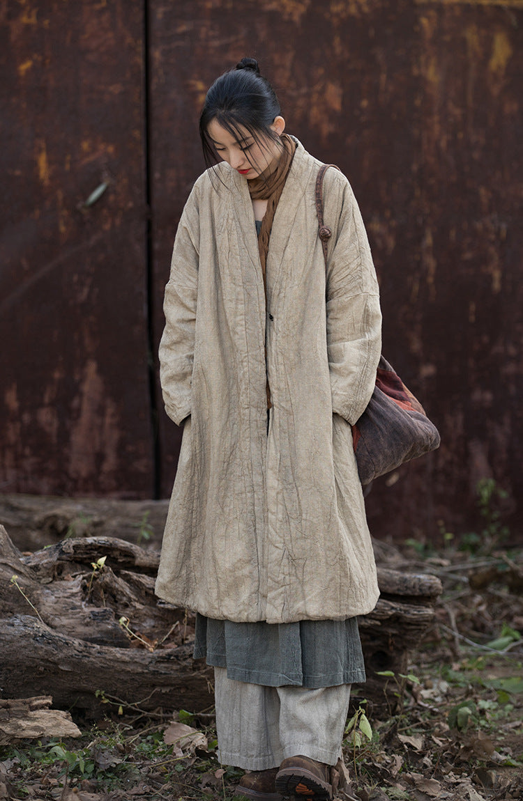 Quilted padding detail on linen coat