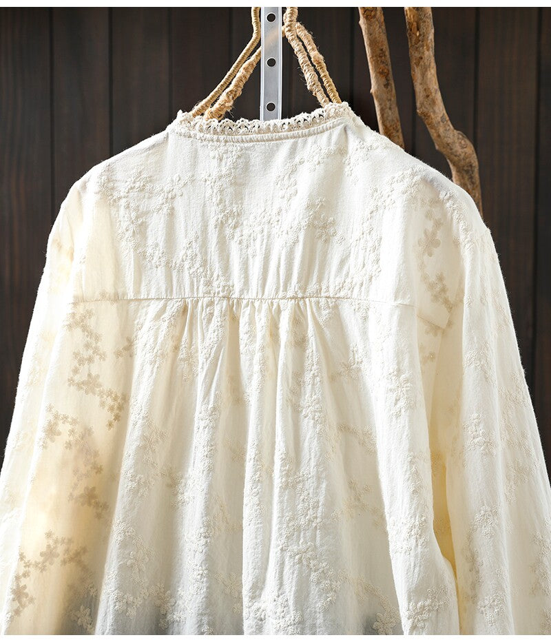 Close-up of embroidery and jacquard pattern on cotton blouse