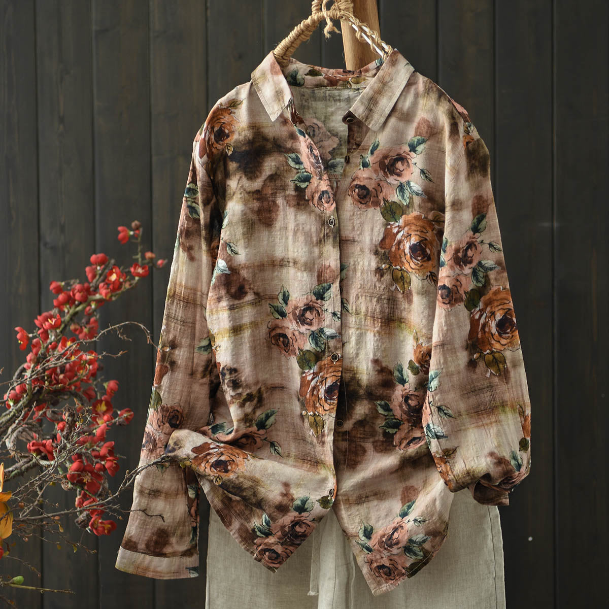 Styled outfit featuring the bohemian floral blouse paired with jeans and accessories for casual chic looks.