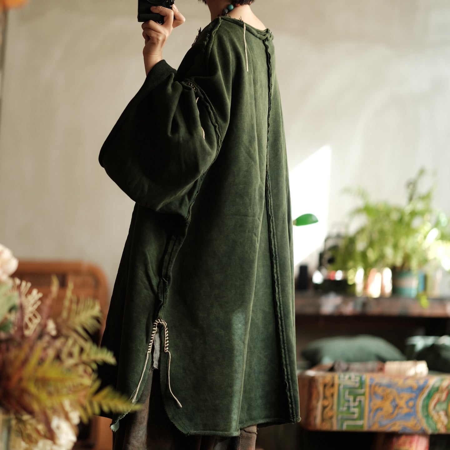 Back view of green cotton blouse for women