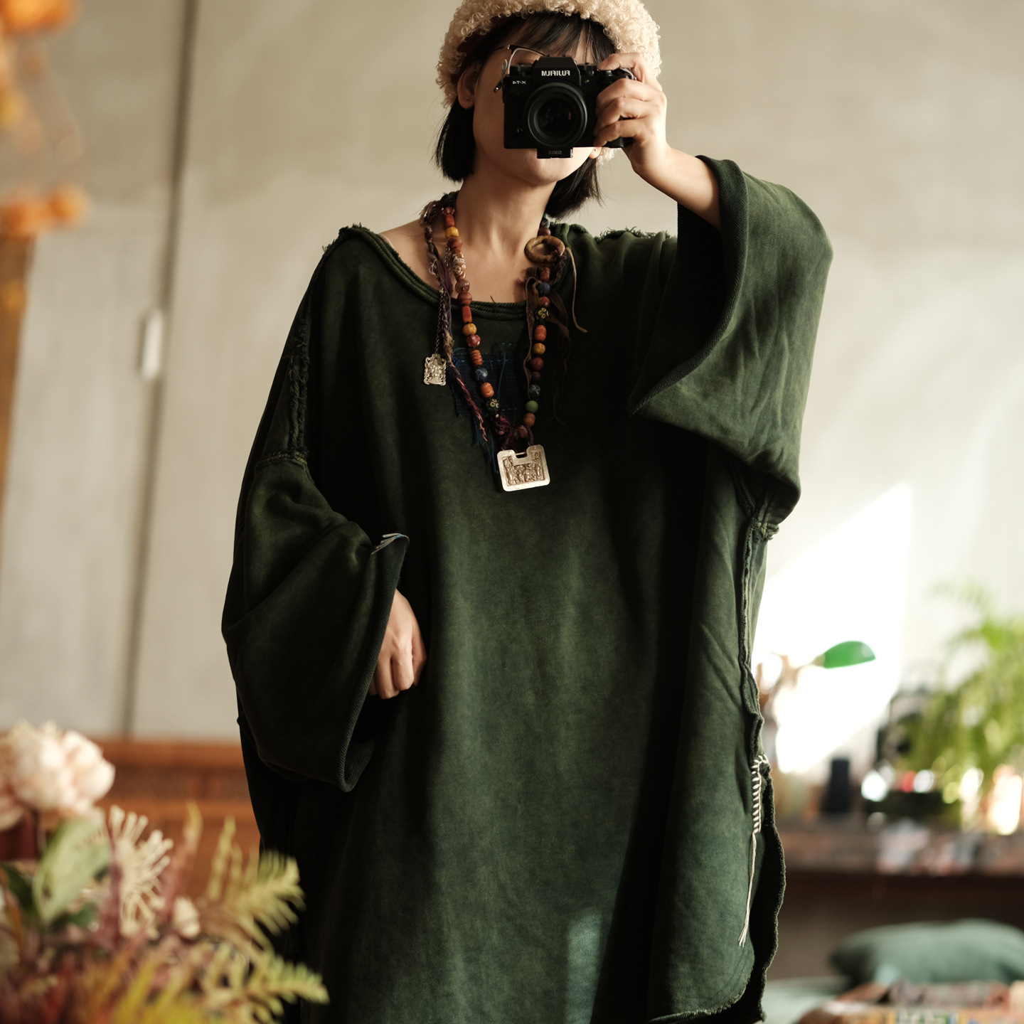 Woman wearing green cotton blouse styled casually