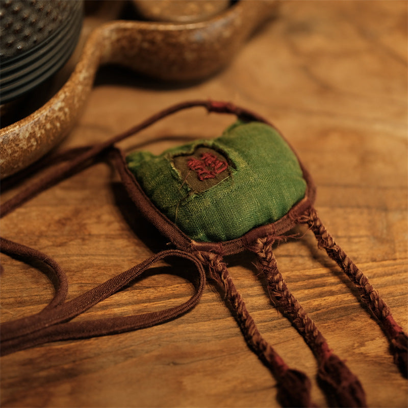 Accessory layered with other handmade pieces