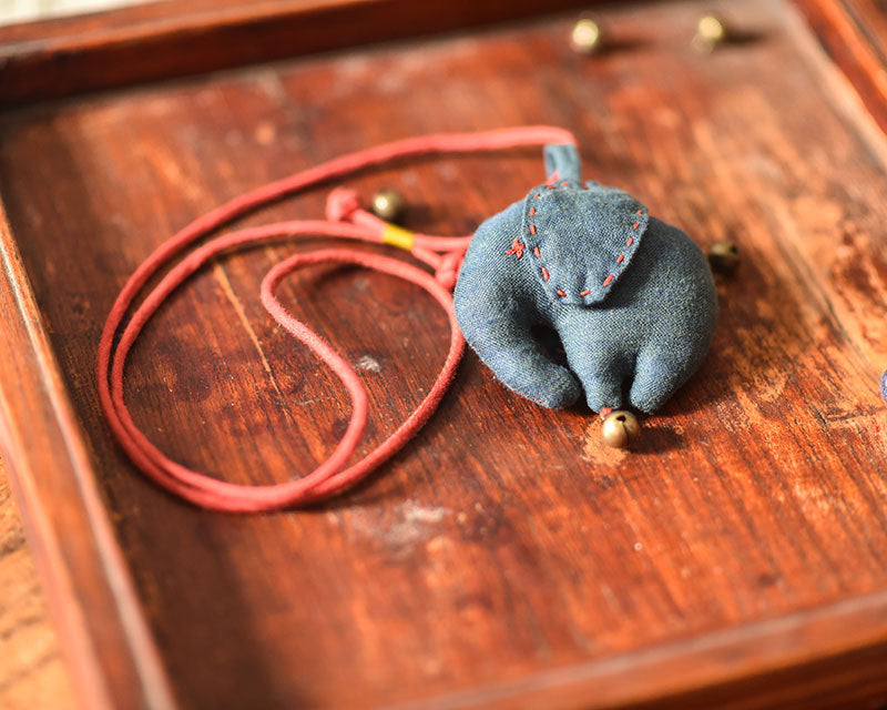 Handcrafted linen elephant accessory front view showing detailed stitching