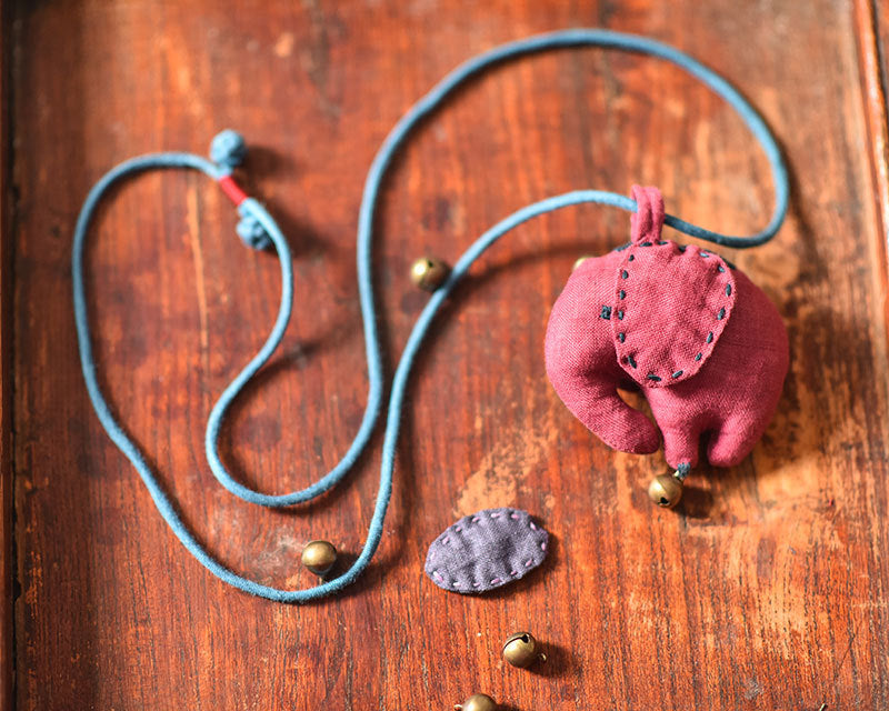 Close-up of elephant-shaped linen accessory showing handmade texture