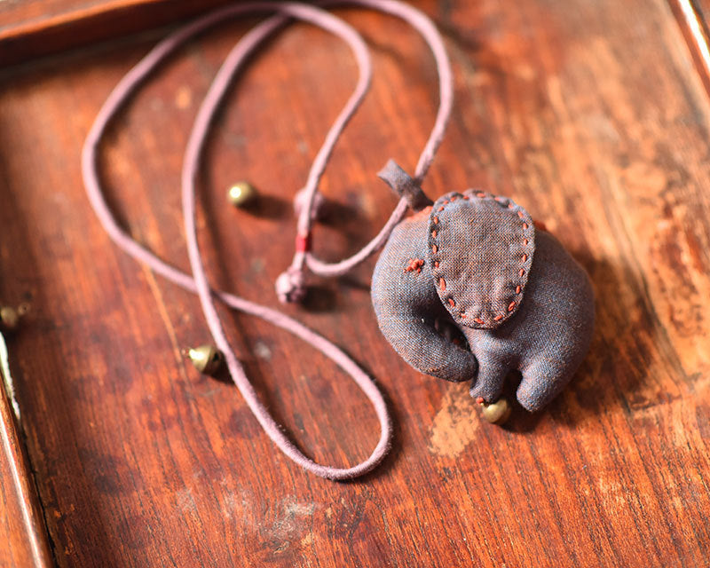 Elephant accessory styled with vintage-inspired décor items