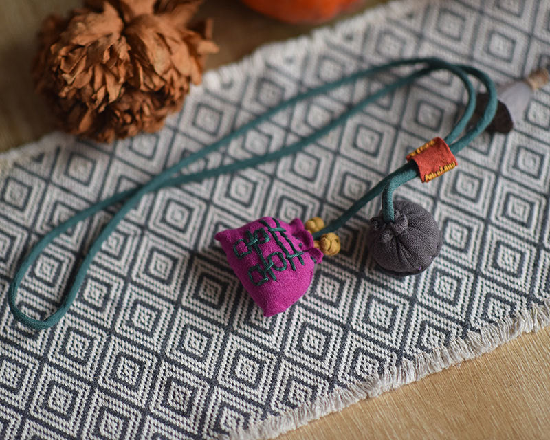 Handcrafted linen lotus accessory paired with home décor items