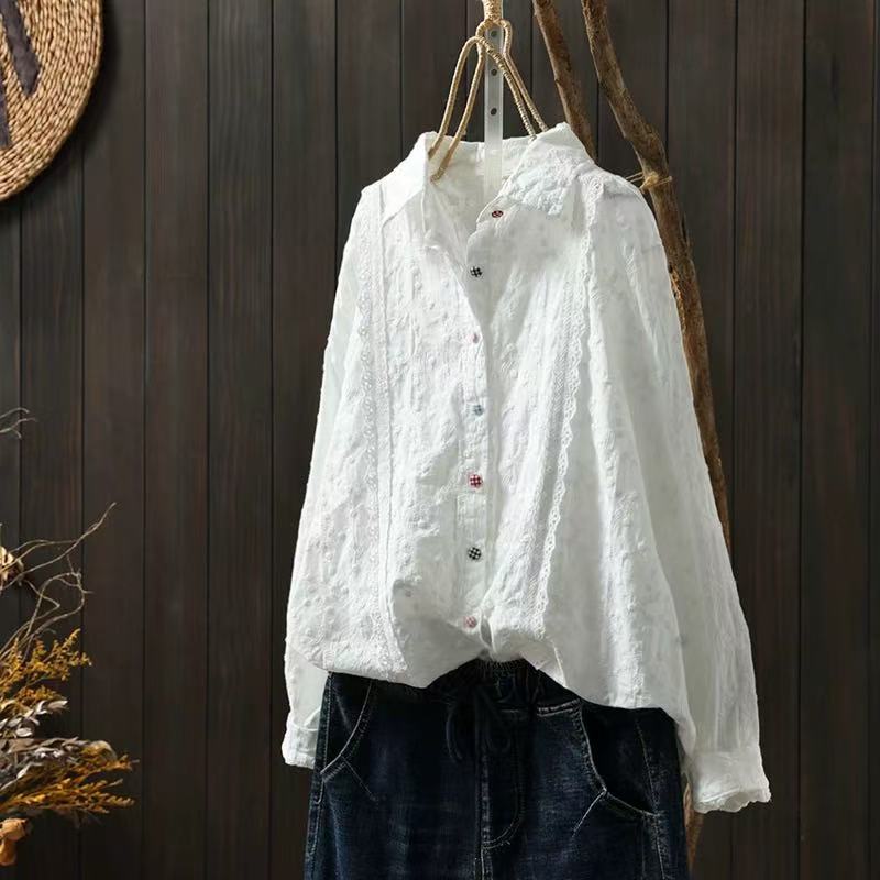 close-up of bohemian embroidered lace blouse fabric