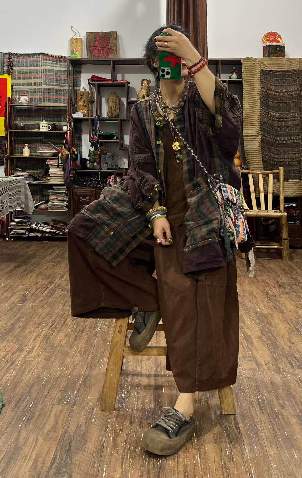 Woman wearing yarn-dyed linen plaid jacket styled casually