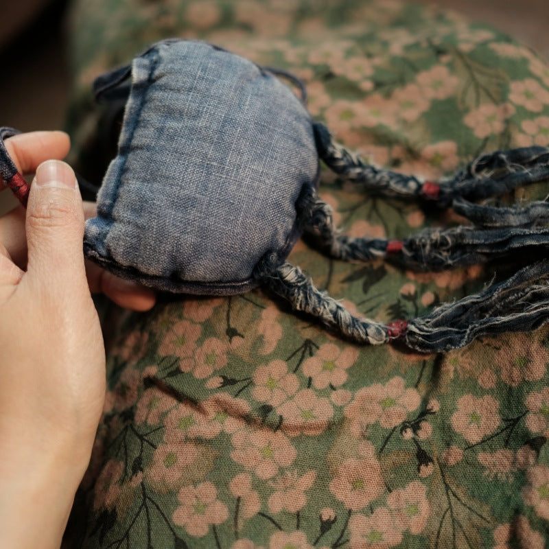 Close-up of embroidered details on washed linen fabric