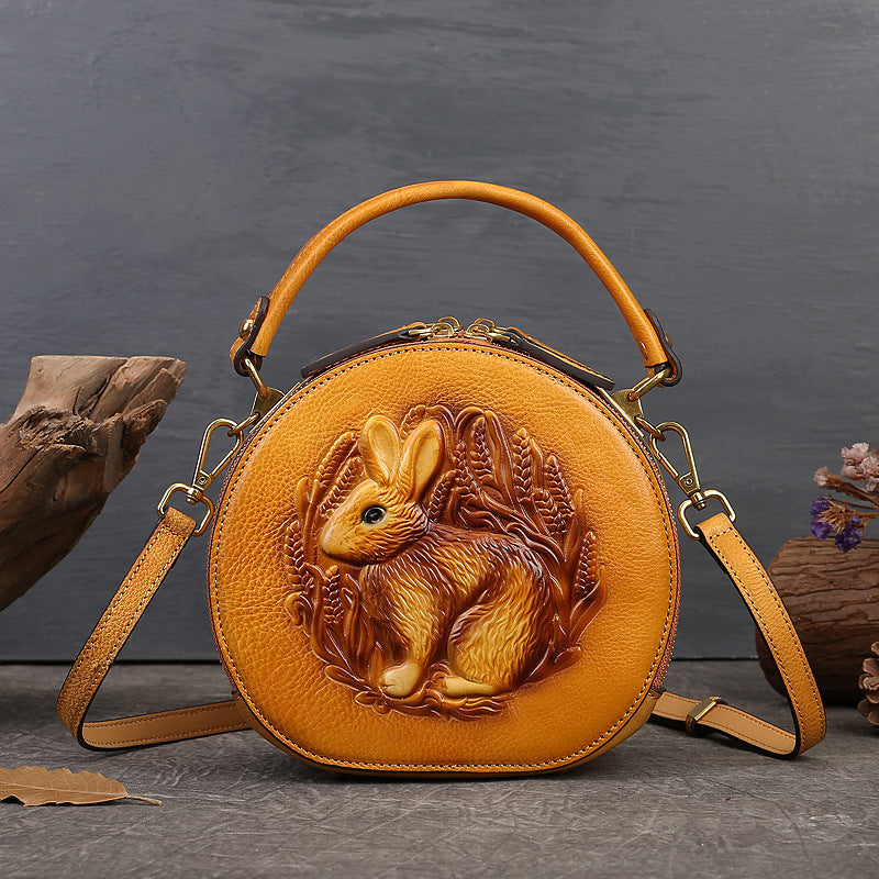 Model carrying vintage rabbit pattern leather Crossbody bag