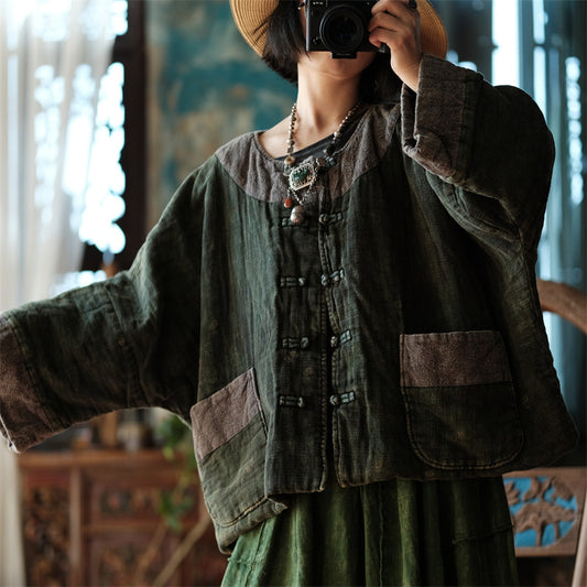 Front view of green distressed quilted short coat vintage jacket
