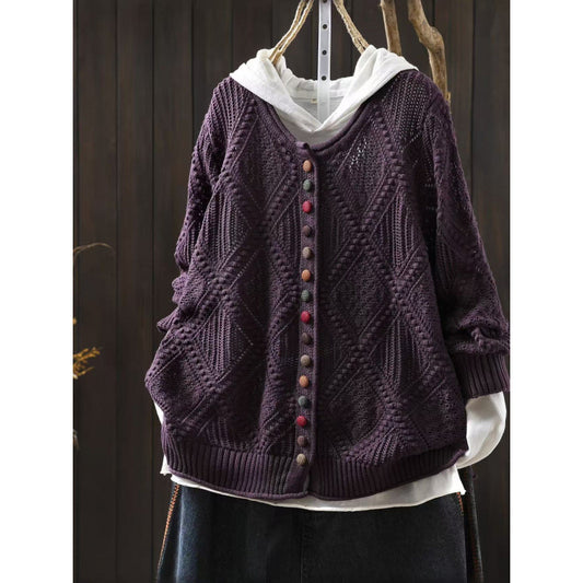 Open-knit sweater with colorful buttons front view