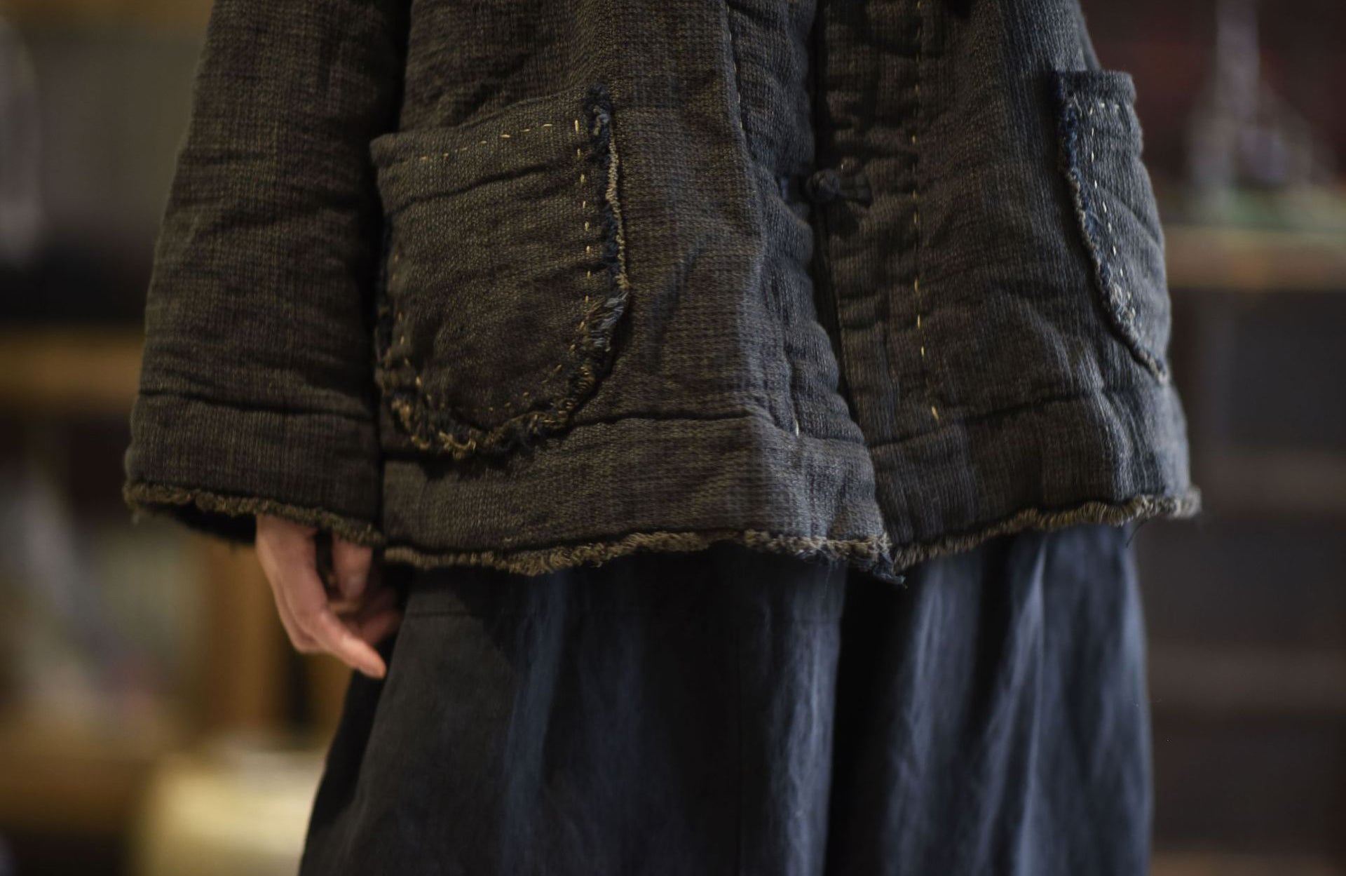 Frayed-edge detail on linen jacket