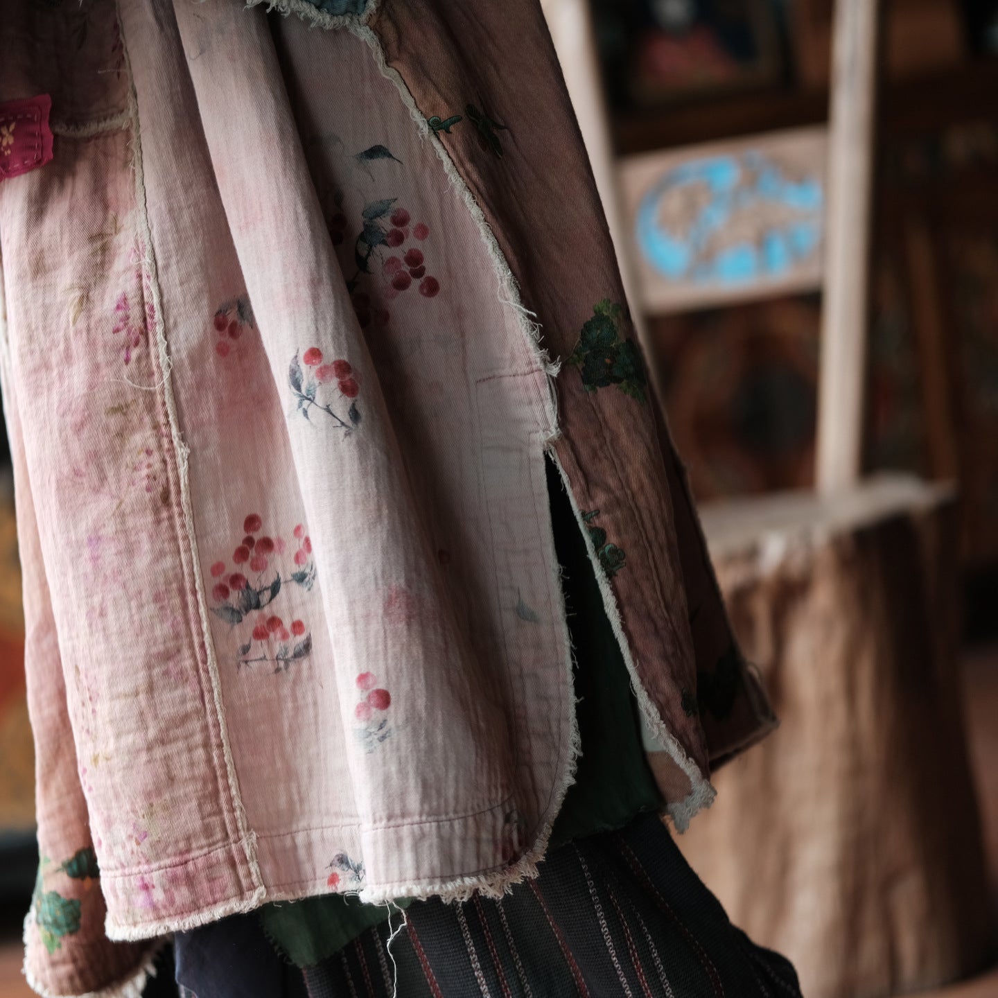 Woman wearing pink floral patchwork tunic dress styled casually