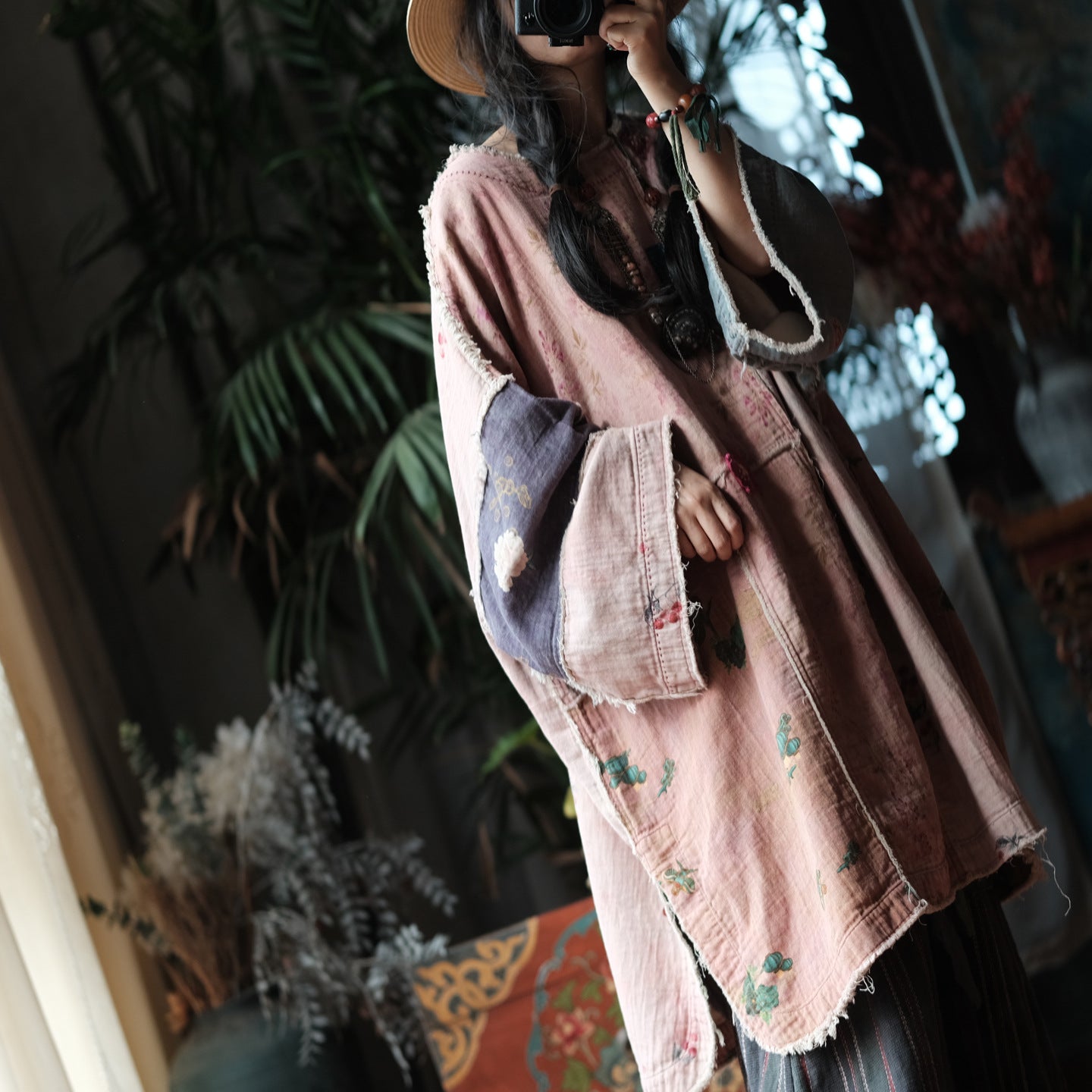 Fabric texture detail of pink floral patchwork tunic dress