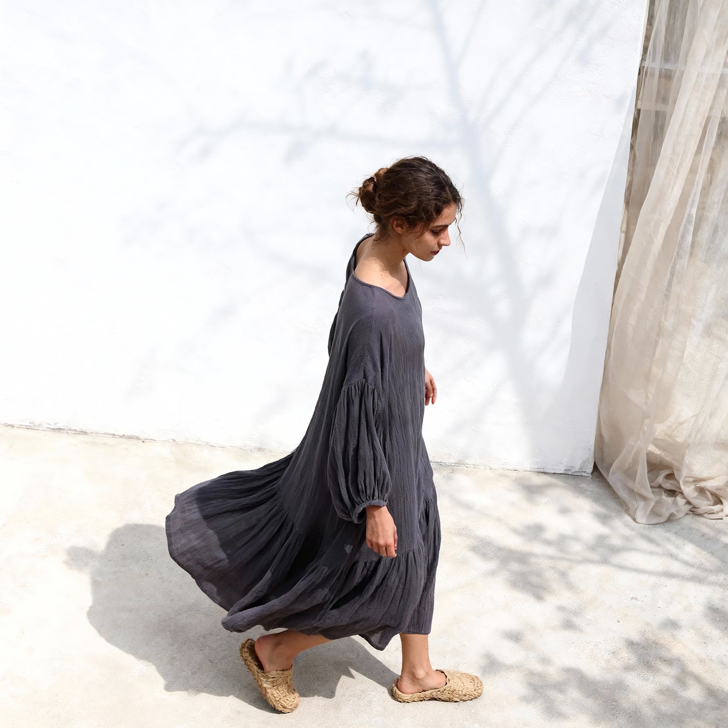 Woman wearing ramie lantern sleeve dress styled casually