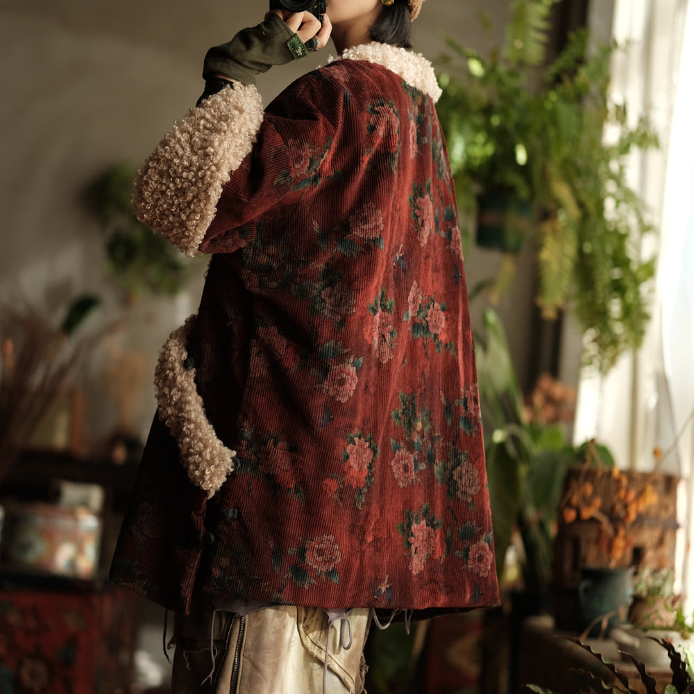 Side profile of red floral corduroy sherpa quilted jacket highlighting quilted padding.