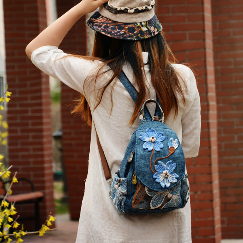 Model wearing a minimalist canvas backpack showing its fit and size