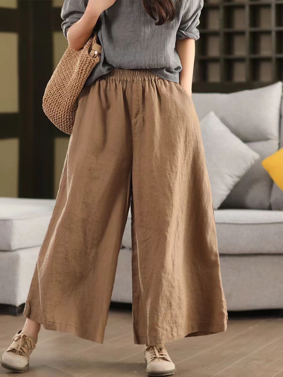 Model moving in breathable wide-leg cotton linen pants