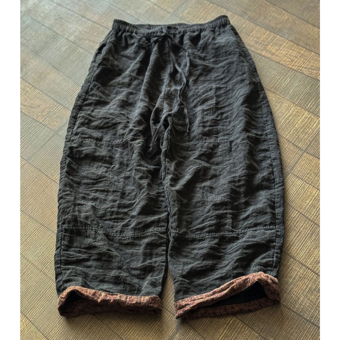 Relaxed linen pants detail showing soft washed fabric texture