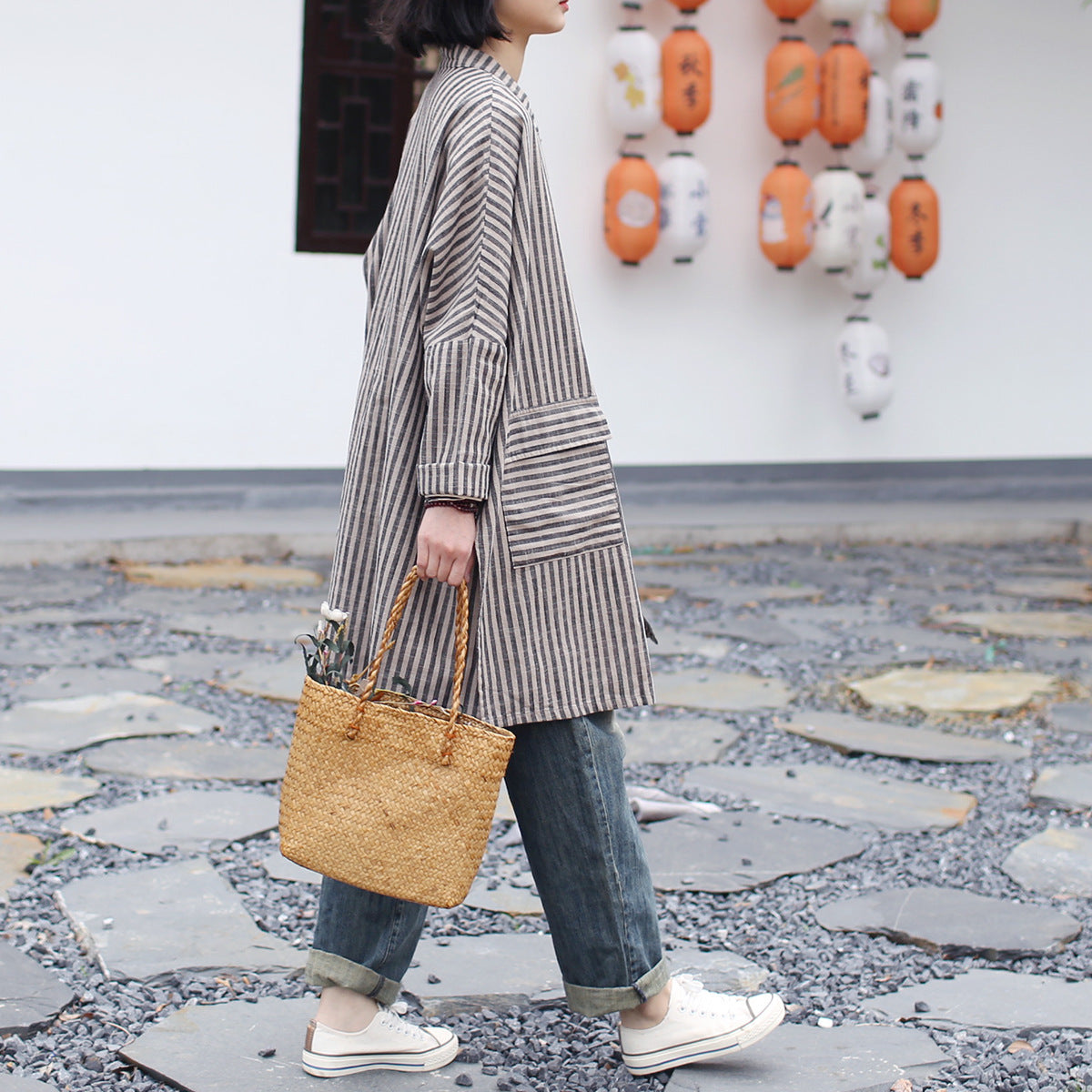 Back view of a minimalist striped linen top with clean seams