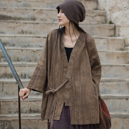 Model wearing boho style distressed cotton-linen tunic jacket