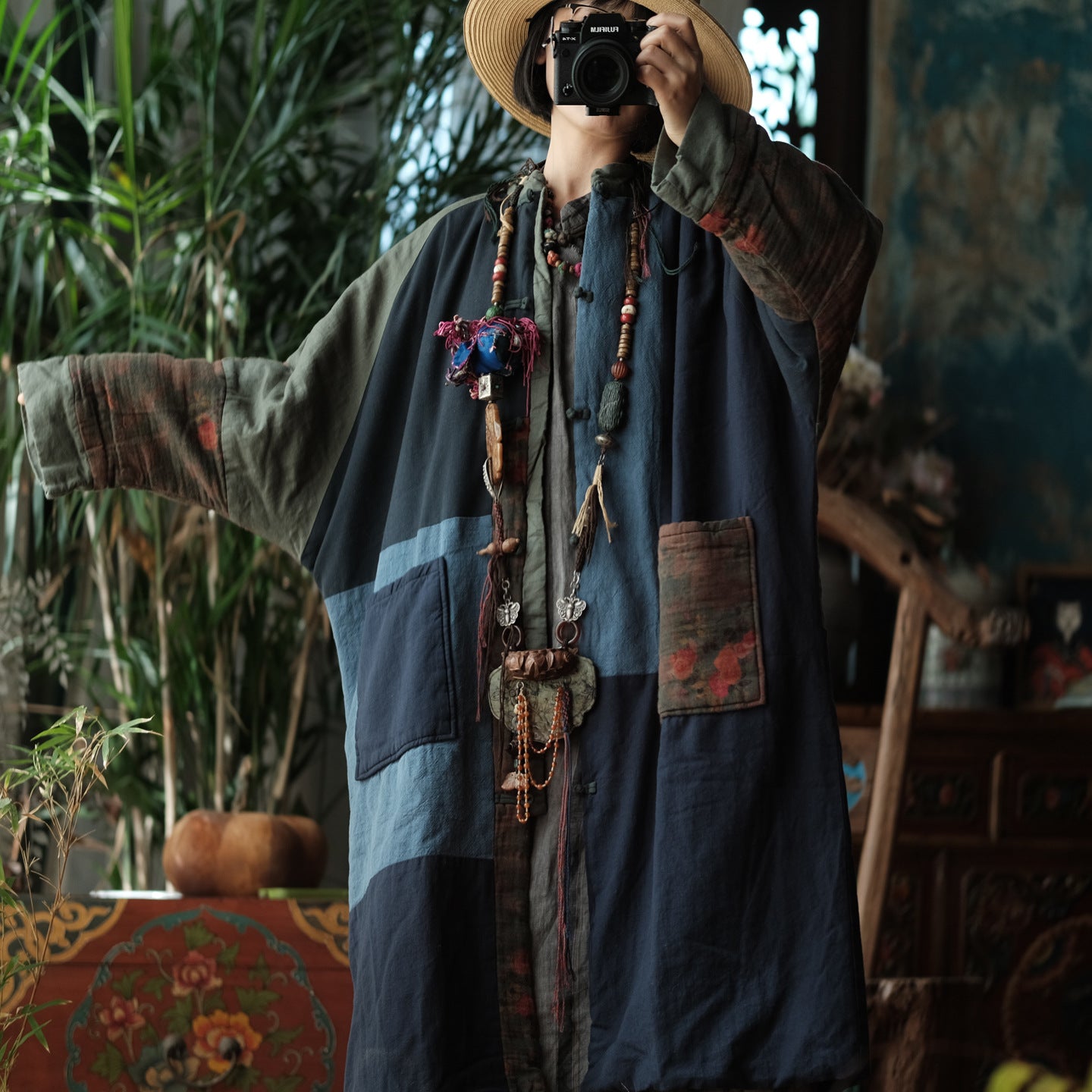 Woman wearing retro blue colorblock quilted coat in Bohemian outfit