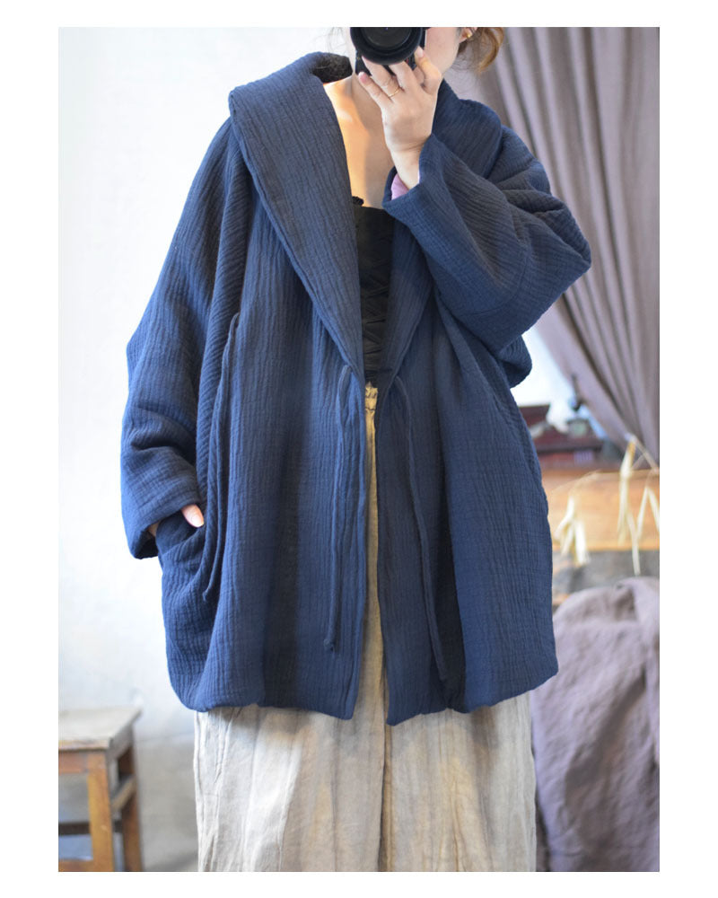 Collar detail on collared crinkled quilted coat