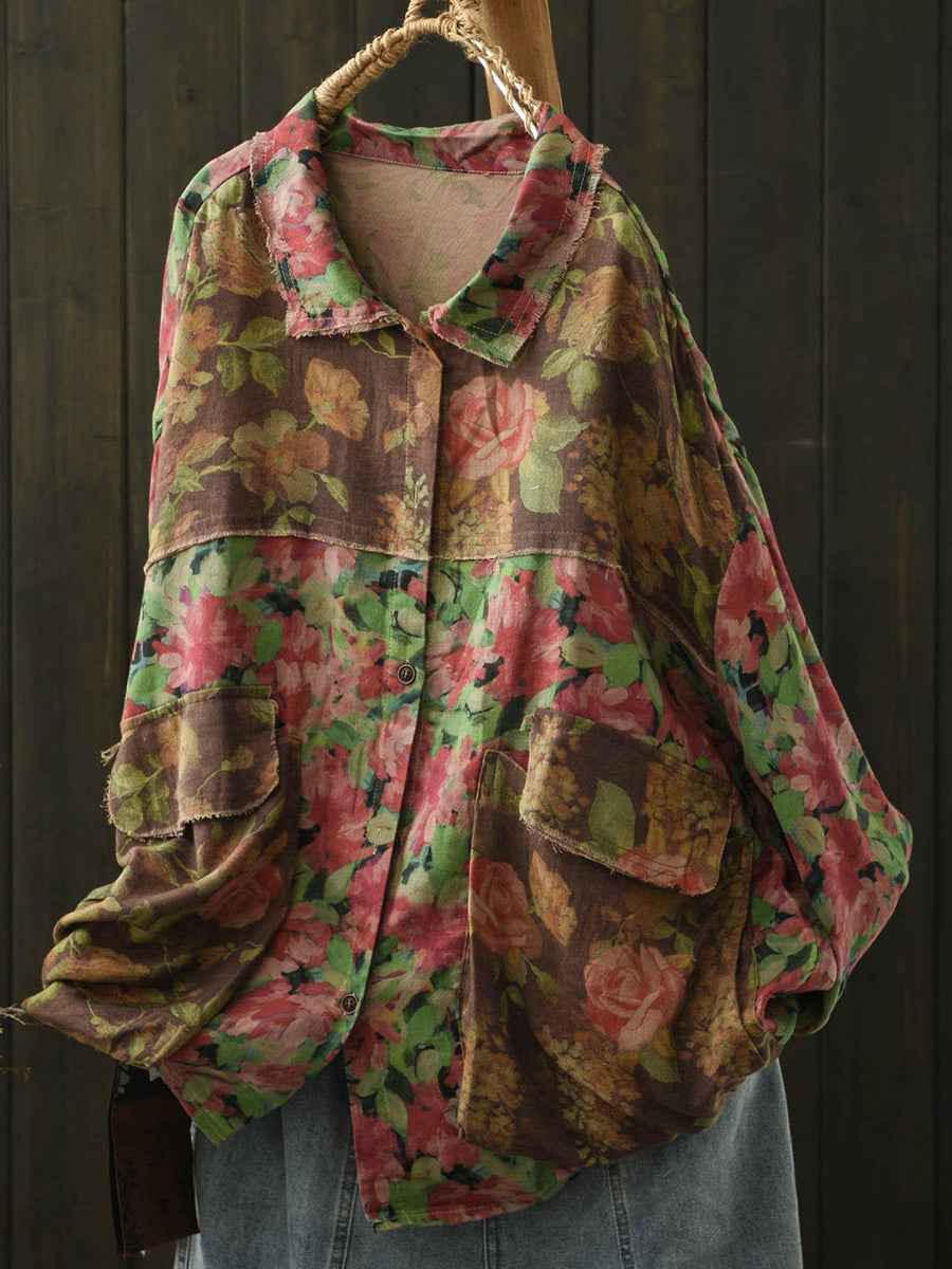 Hippie-style vintage distressed floral blouse, perfect for bohemian casual chic outfits with an asymmetric hem.