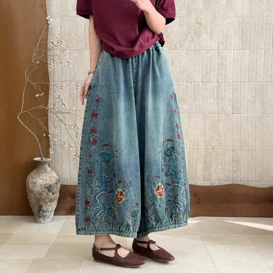 Vintage embroidered denim pants front view with a relaxed fit