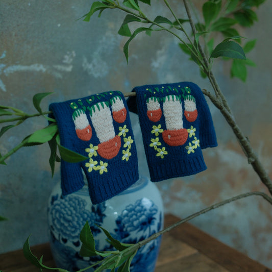 Front view of vintage knitted embroidered gloves for women