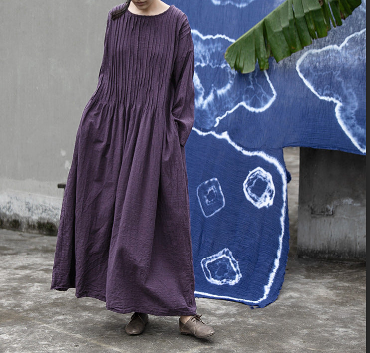 Woman wearing accordion pleated dress styled casually